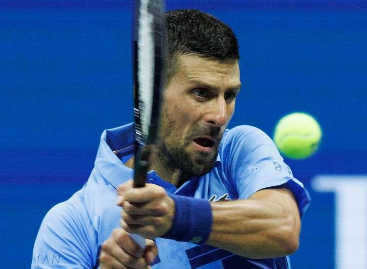 Djokovic durante gli Us Open - fonte Ansa Foto - suipedali.it